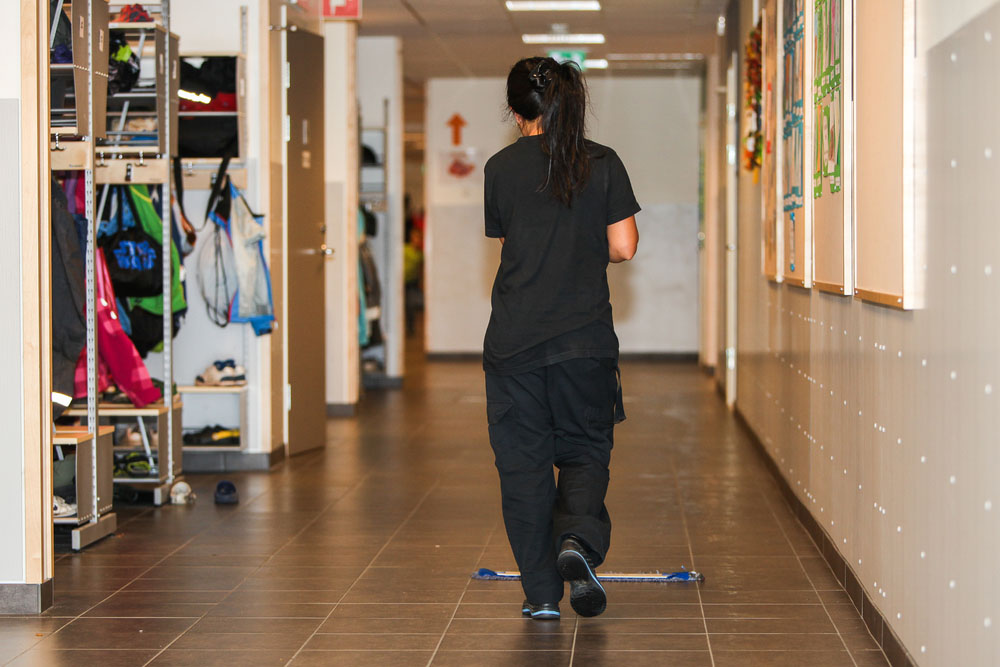 School Cleaning Services | woman cleaning school floor