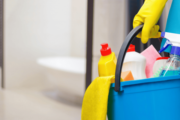 Office Deep Cleaning | Hand holding a bucket of cleaning products